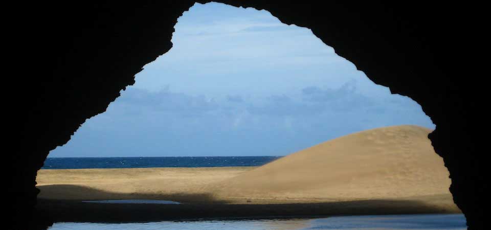 Mindfulness. Kauai beach from cave.